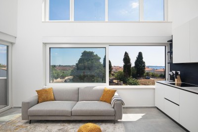 We are selling a penthouse with a sea view in Fazana