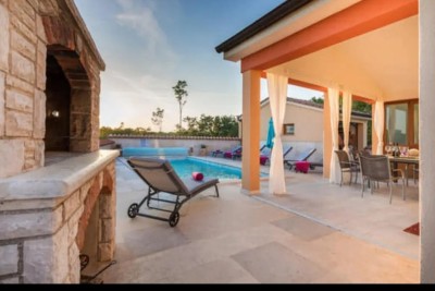 A beautiful house with a pool, surrounded by greenery!